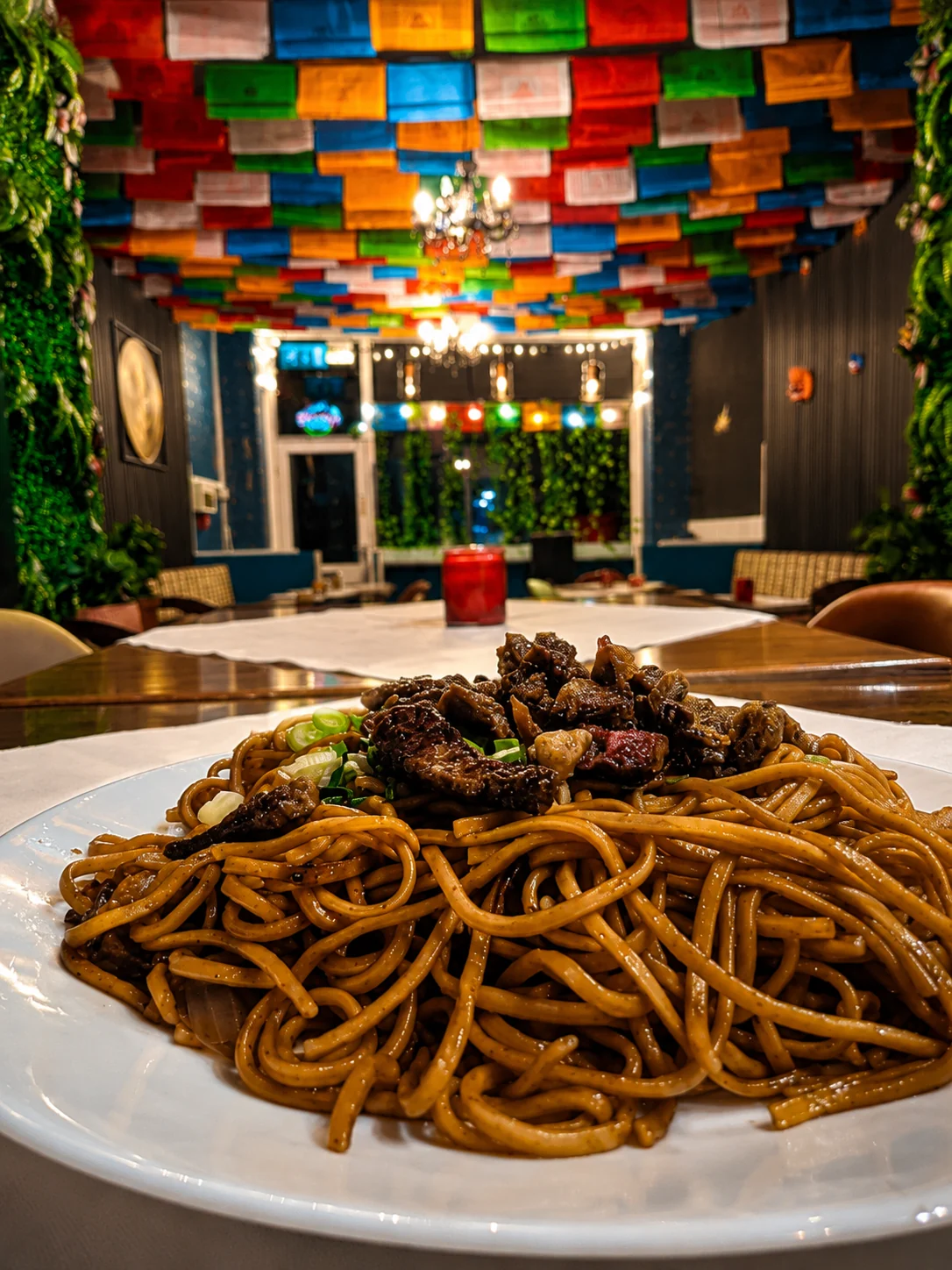 Bhutanese noodles served beneath colourful prayer flags